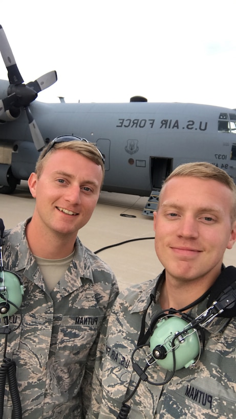 Tech. Sgt. Joel Putnam, a 94th Aircraft Maintenance Squadron crew chief, left, and his brother, Staff Sgt. Jeremy Putnam, a 94th Maintenance Squadron aerospace propulsion technician, pose for a photo in front of a C-130H3 Hercules at Dobbins Air Reserve Base, Ga. Joel and his brother Jeremy are both assigned to the 94th Maintenance Group at Dobbins Air Reserve Base, Ga. (U.S. Air Force photo/Senior Airman Justin Clayvon)