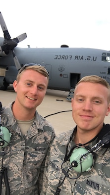 Tech. Sgt. Joel Putnam, a 94th Aircraft Maintenance Squadron crew chief, left, and his brother, Staff Sgt. Jeremy Putnam, a 94th Maintenance Squadron aerospace propulsion technician, pose for a photo in front of a C-130H3 Hercules at Dobbins Air Reserve Base, Ga. Joel and his brother Jeremy are both assigned to the 94th Maintenance Group at Dobbins Air Reserve Base, Ga. (U.S. Air Force photo/Senior Airman Justin Clayvon)