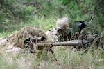 The current ghillie suit, known as the Flame Resistant Ghillie System, is shown here. A new suit, called the Improved Ghillie System, or IGS, is under development. (Photo Credit: U.S. Army photo)