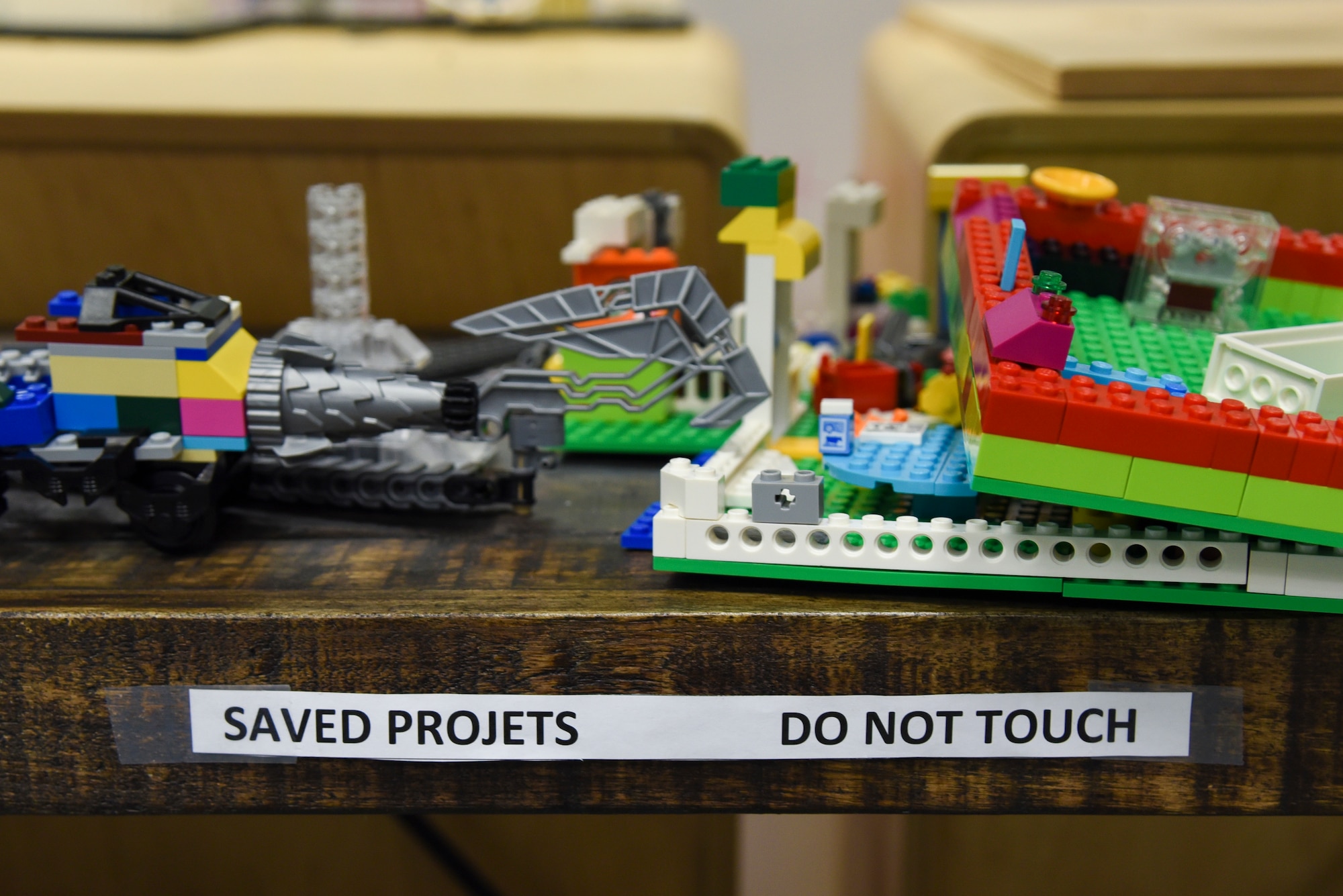 Student projects are displayed on a shelf during the Ramstein Youth Center tour portion of the 86th Airlift Wing Commander’s Mission Support Group Immersion on Ramstein Air Base, Germany, Oct. 2, 2018. During the tour of the youth center, spouses visited the gymnasium and multipurpose rooms and received a brief on the numerous programs available. (U.S. Air Force photo by Airman D. Blake Browning)