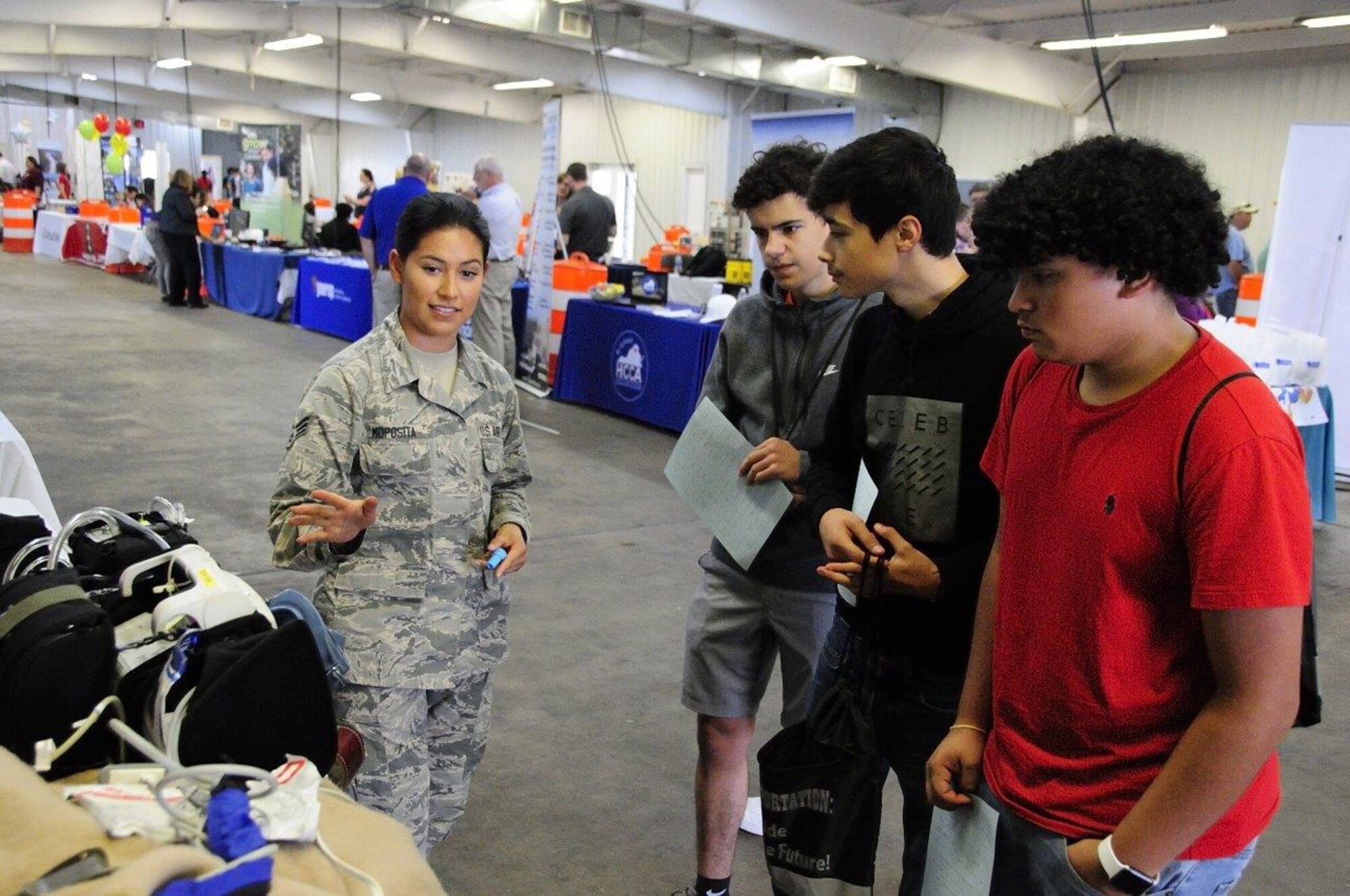 SrA Maria Moposita, a medical technician with the 459 AES, talks to students about her career at the 14th Annual Northern .Transportation Career Fair for High School Students in Manassas, Va. The career fair is part of a Federal Highway Administration initiative to promote the transportation industry and the careers it offers to America’s youth.