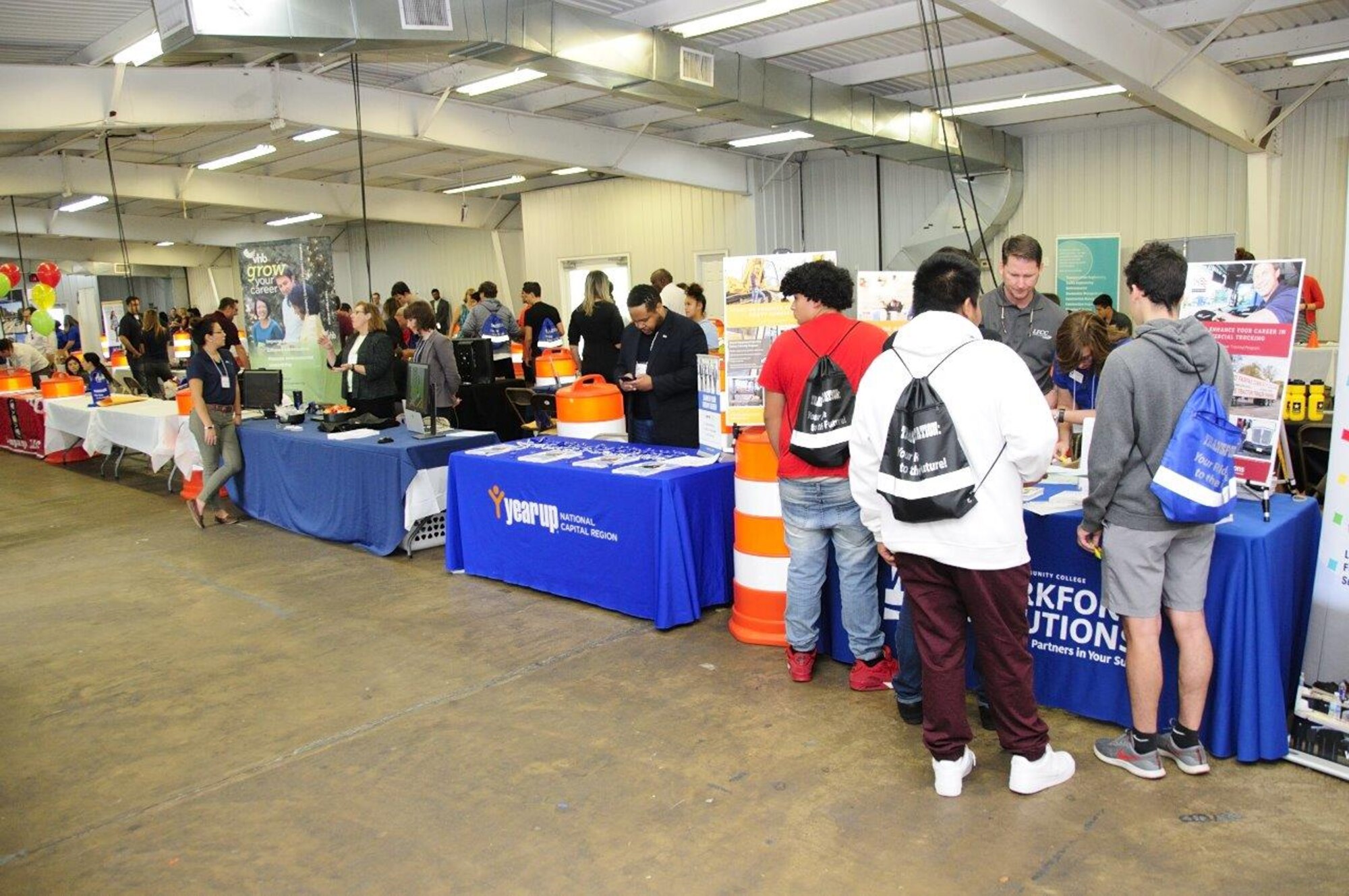 Flight nurses and medical technicians of the 459th Aeromedical Evacuation Squadron talk to students about their careers at the 14th Annual Northern Virginia Transportation Career Fair for High School Students in Manassas, Va. The career fair is part of a Federal Highway Administration initiative to promote the transportation industry and the careers it offers to America’s youth.