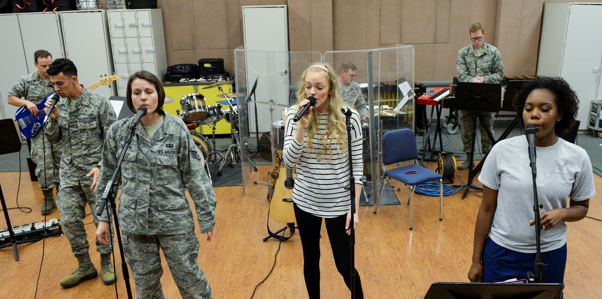 Singer Alexis Gomez, rehearses with the Air Force Band of Flight inside their offices at Wright-Patterson Air Force Base, Ohio, Sept. 27. 2018.