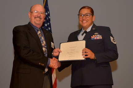 Retired Col. Brendel Kreighbaum presented the Pitsenbarger Award to Tech. Sgt. Rebecca Roa, 437th Aircraft Maintenance Squadron during a Community College of the Air Force ceremony Oct. 4, 2018 on Joint Base Charleston, S.C. The Pitsenbarger Award provides a one-time grant of $400 to selected Air Force enlisted personnel graduating from the CCAF who plan to pursue a bachelor’s degree.