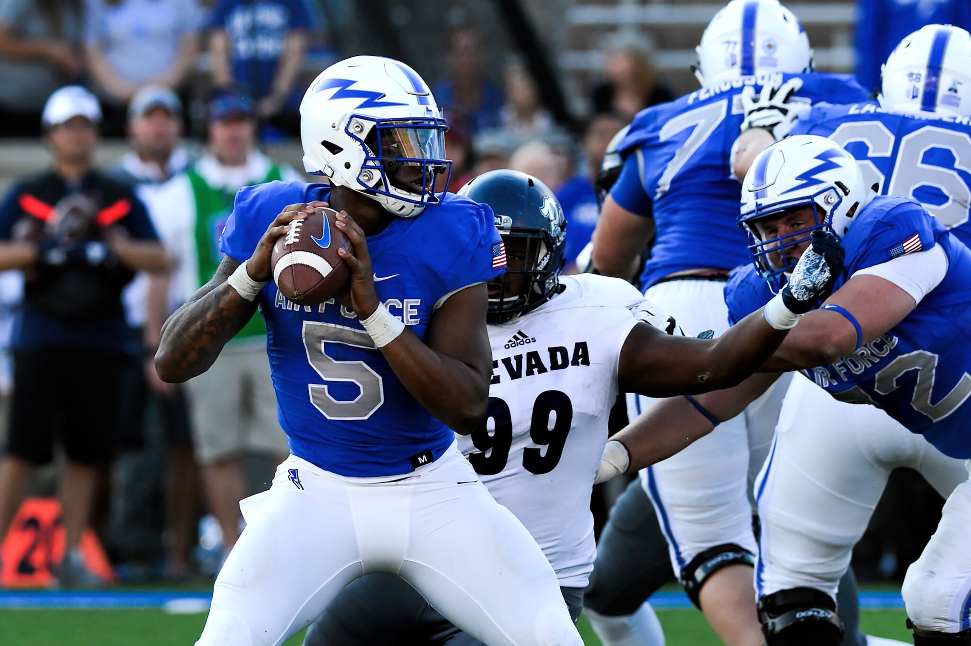 Donald Hammond III, U.S. Air Force Academy Falcons quarterback, looks to make a pass during a game against the Nevada Wolfpack at Falcon Stadium in Colorado Springs, Colo., Sept. 29, 2018. The Wolfpack defeated the Falcons 28-25 as a furious fourth quarter comeback by the Falcons fell short. (U.S. Air Force photo by Bill Evans)