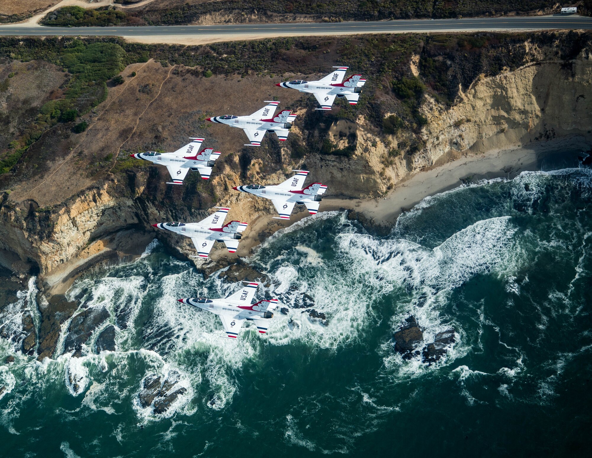 The U.S. Air Force Air Demonstration Squadron "Thunderbirds" fly near the Pacific Coast Oct. 1, 2018, while returning to Nellis Air Force Base, Nev. Since 1953, the Thunderbirds have served as America’s premier air demonstration squadron. (U.S. Air Force photo by Staff Sgt. Ashley Corkins)