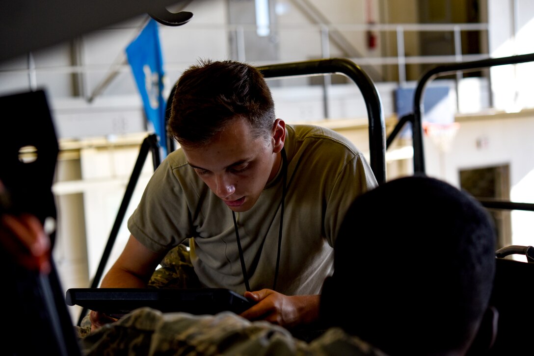Electrical and environmental systems apprentice course Airmen replace components on an F-15 Eagle.