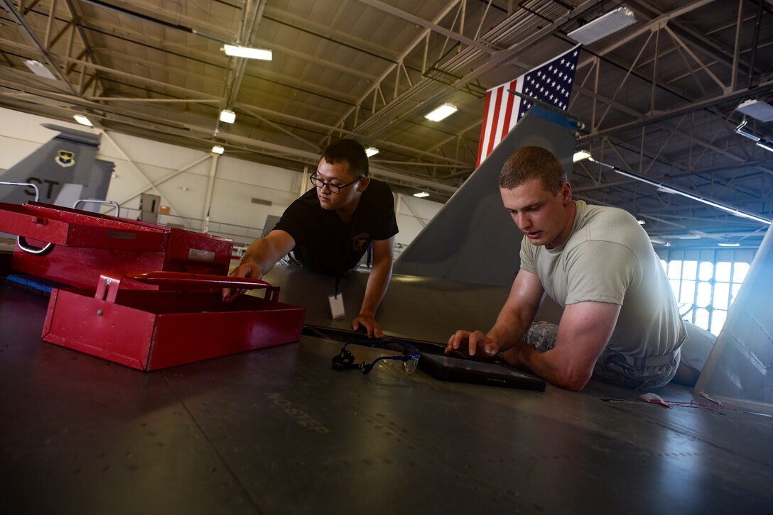 Electrical and environmental systems apprentice course Airmen replace components on an F-15 Eagle.