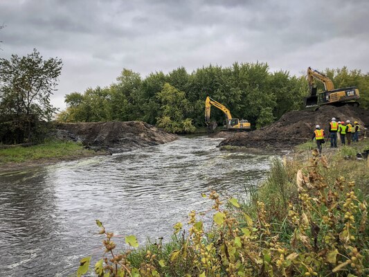 heavy equipment breaches dam embankment