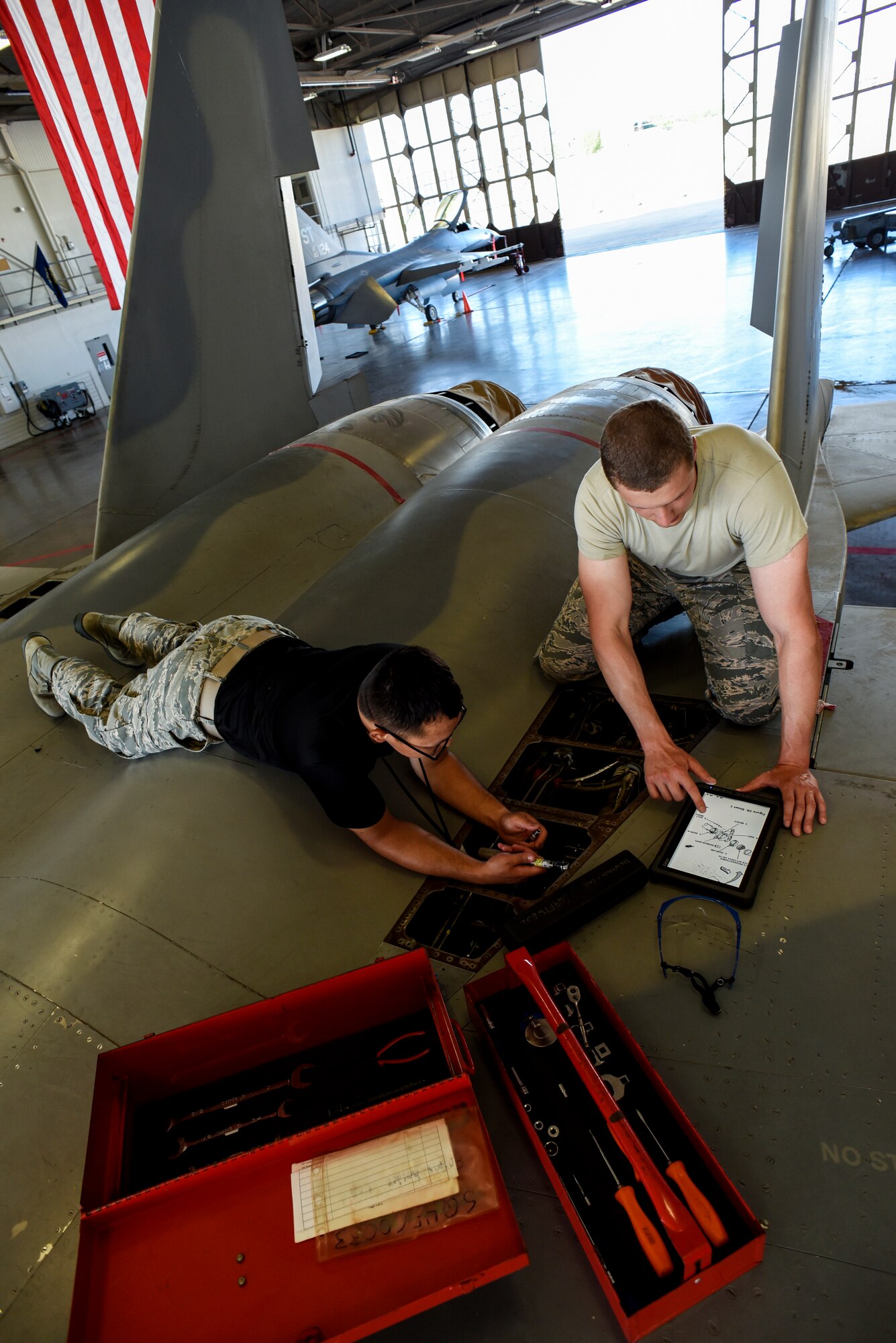 Electrical and environmental systems apprentice course Airmen replace components on an F-15 Eagle.