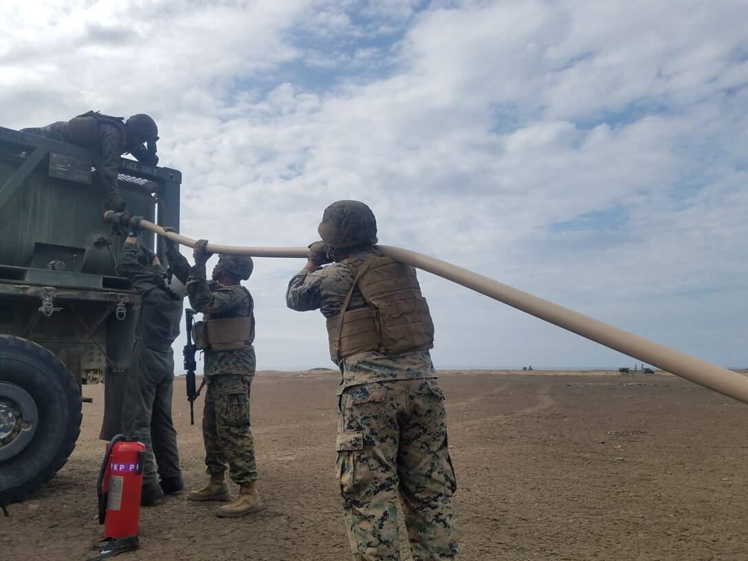 October 2018 - 9th Comm Bn Marines transfer 600 gallons of fuel from the Osprey to the fuel six-con with the assistance of VMM-364 during Battalion Field Training Exercise