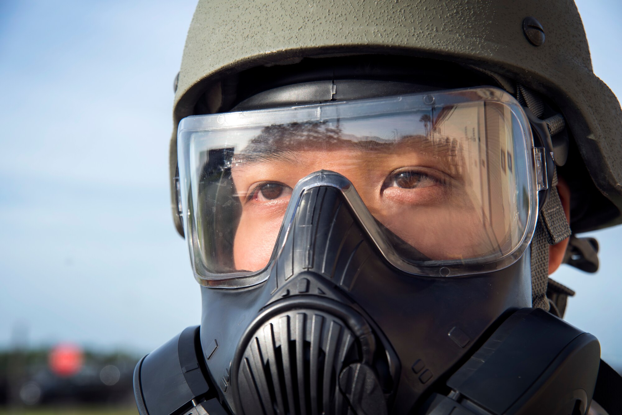 U.S. Air Force Staff Sgt. Frank Sanaxay, a vehicle operator assigned to the 927th Logistic Readiness Squadron, wears a mission-oriented protective posture (MOPP) gas mask and helmet after a MOPP gear fitting at MacDill Air Force Base, Fla., Oct. 2, 2018.