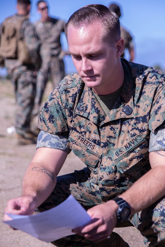 U.S. Navy Hospital Corpsman 3rd Class Joshua Freers, with Task Force Koa Moana, reviews test criteria, during a Combat Lifesaver (CLS) course at Marine Corps Base Camp Pendleton, Calif., Sept. 20, 2018. The CLS course taught Marines how to properly apply life-saving interventions in tactical combat situations. (U.S. Marine Corps photo by Cpl. Branden J. Bourque)