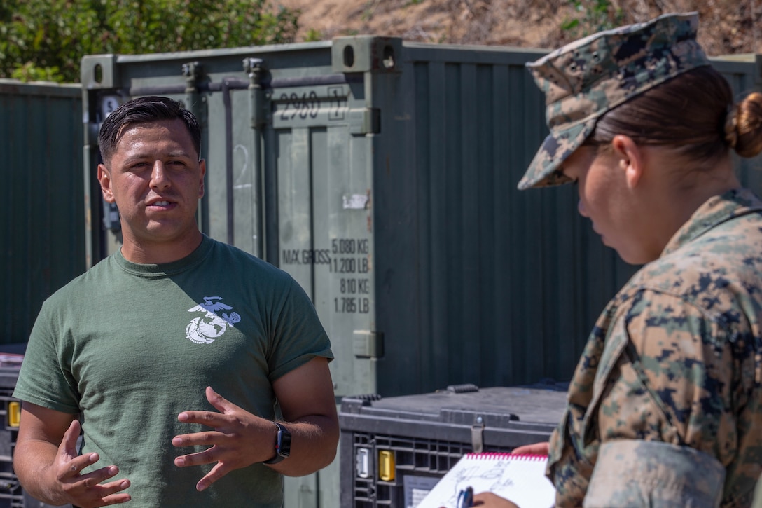U.S. Marine Corps Sgt. Aaron Salcidosoto, left, a water support technician with the combat engineer detachment, teaches a class to Lance Cpl. Elizabeth Magee, a drafter and surveyor, both with Task Force Koa Moana, at Marine Corps Base Camp Pendleton, Calif., Sept. 26, 2018. Salcidosoto taught a class about the functions and capabilities of the lightweight water purification system. (U.S. Marine Corps photo by Cpl. Branden J. Bourque)