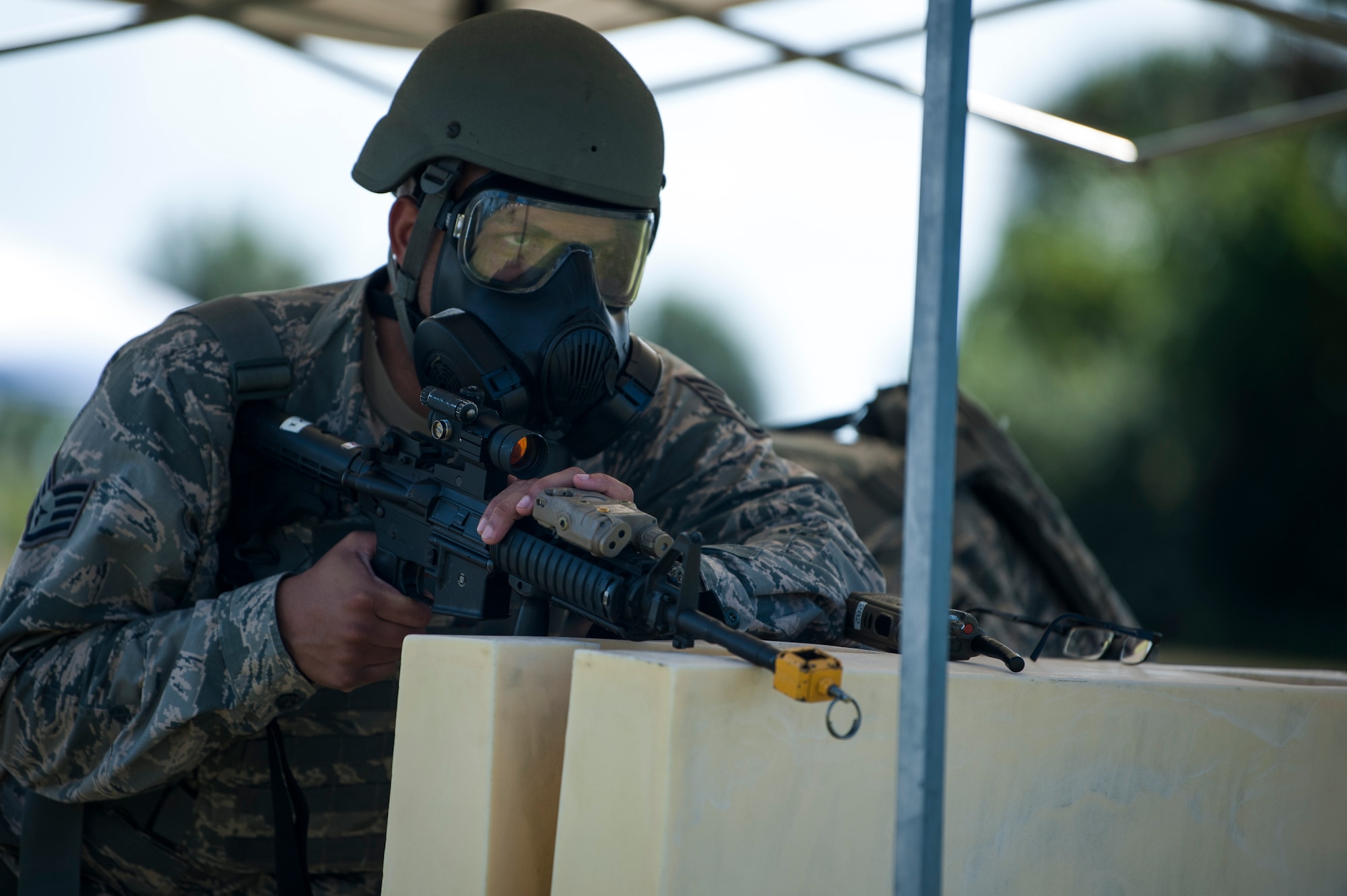 U.S. Air Force Staff Sgt. Mark Rodriguez, an investigator assigned to the 6th Security Forces Squadron, provides cover at a simulated forward operating position during a 6th Air Mobility Wing operational readiness assessment (ORA), Oct. 4, 2018 at MacDill Air Force Base, Fla.