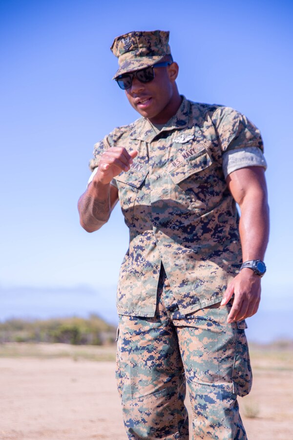 U.S. Navy Hospital Corpsman 2nd Class Andre Conway, with Task Force Koa Moana, instructs a Combat Lifesaver (CLS) course at Marine Corps Base Camp Pendleton, Calif., Sept. 20, 2018. The CLS course taught Marines how to properly apply life-saving interventions in tactical combat situations. (U.S. Marine Corps photo by Cpl. Branden J. Bourque)