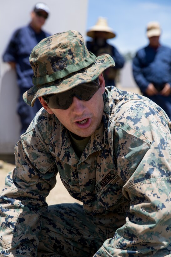 U.S. Marine Corps Cpl. Joshua R. Sena, a military policeman with 1st Law Enforcement (LE) Battalion, Task Force Koa Moana (TF KM), teaches civilian role players a class on LE techniques during TF KM Mission Rehearsal Exercise at Marine Corps Base Camp Pendleton, Calif., July 17, 2018. The exercise confirms TF KM is capable of cross cultural interaction, instruction, and relationship building while training alongside partner nations in order to meet Theater Security Cooperation engagement objectives. (U.S. Marine Corps photo by Staff Sgt. Gabriela Garcia)