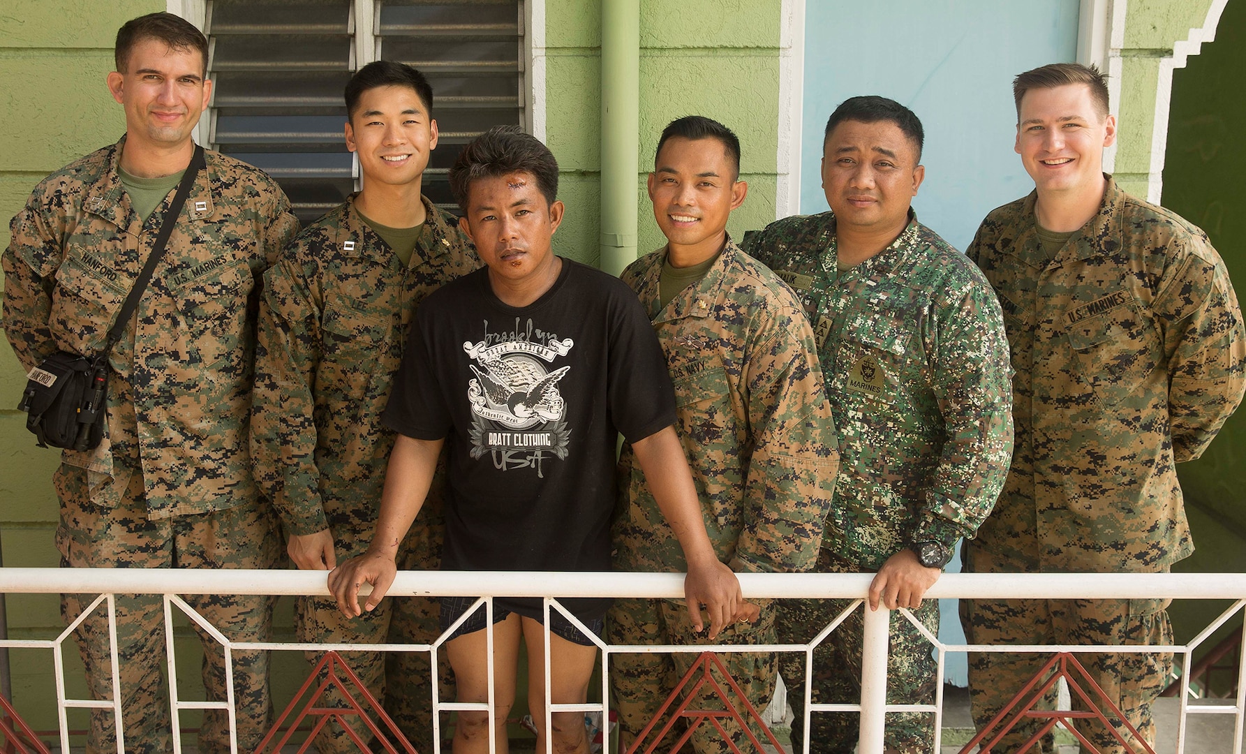 U.S. Marines and Sailors aid in local accident