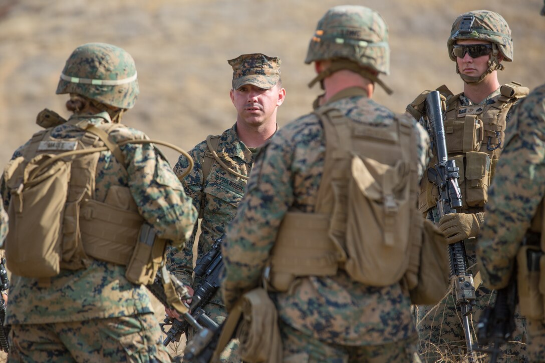 U.S. Marine Corps Sgt. Tyler C. Strawser, back center, the guide for Bravo Company, 7th Engineer Support Battalion (ESB), Task Force Koa Moana (TF KM), briefs 7th ESB Marines during the TF KM Mission Rehearsal Exercise at Marine Corps Base Camp Pendleton, Calif., July 18, 2018. The exercise confirmed TF KM is capable of cross cultural interaction, instruction, and relationship building while training alongside partner nations in order to meet Theater Security Cooperation engagement objectives. (U.S. Marine Corps photo by Staff Sgt. Gabriela Garcia)