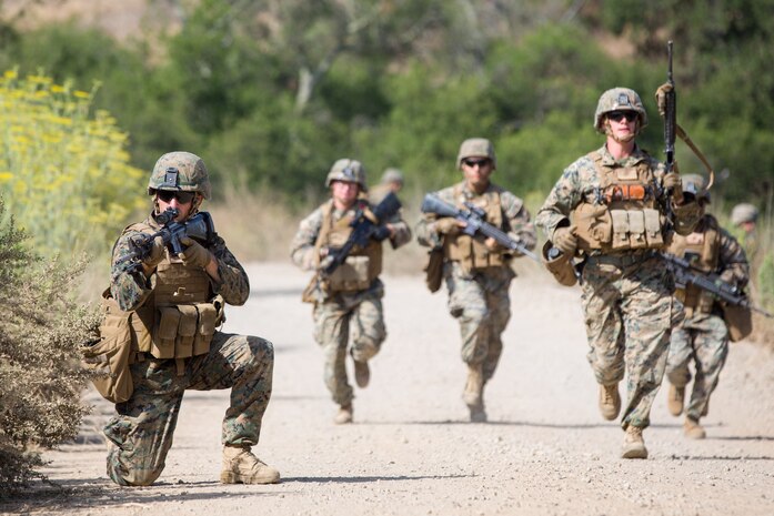 U.S. Marine Corps Cpl. Logan J. Hakes, left, a combat engineer with Bravo Company, 7th Engineer Support Battalion, Task Force Koa Moana (TF KM), provides security during a patrol during the TF KM Mission Rehearsal Exercise at Marine Corps Base Camp Pendleton, Calif., July 18, 2018. The exercise confirmed TF KM is capable of cross cultural interaction, instruction, and relationship building while training alongside partner nations in order to meet Theater Security Cooperation engagement objectives. (U.S. Marine Corps photo by Staff Sgt. Gabriela Garcia)