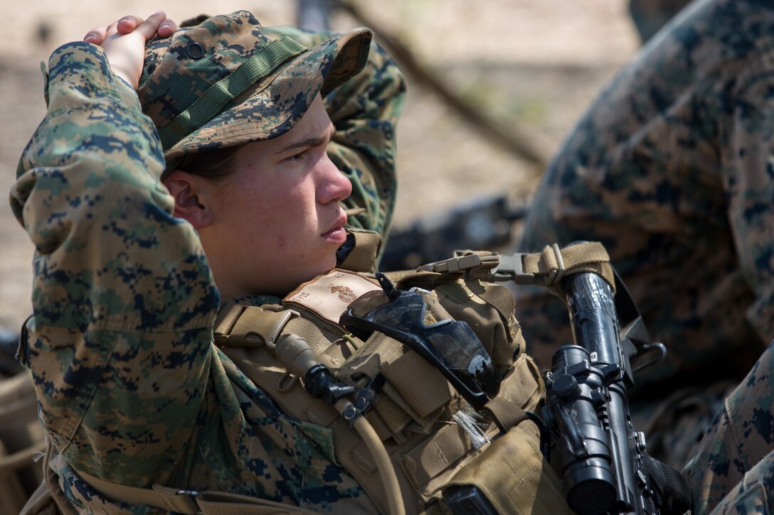 U.S. Marine Corps Lance Cpl. Elizabeth L. Magee, a technical engineer with Bravo Company, 7th Engineer Support Battalion, Task Force Koa Moana (TF KM), listens to a debrief during the TF KM Mission Rehearsal Exercise at Marine Corps Base Camp Pendleton, Calif., July 18, 2018. The exercise confirmed TF KM is capable of cross cultural interaction, instruction, and relationship building while training alongside partner nations in order to meet Theater Security Cooperation engagement objectives. (U.S. Marine Corps photo by Staff Sgt. Gabriela Garcia)