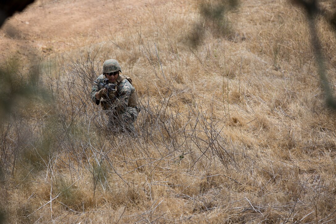 A U.S. Marine with Bravo Company, 7th Engineer Support Battalion, Task Force Koa Moana (TF KM), participates in a contact left attack during the TF KM Mission Rehearsal Exercise at Marine Corps Base Camp Pendleton, Calif., July 18, 2018. The exercise confirmed TF KM is capable of cross cultural interaction, instruction, and relationship building while training alongside partner nations in order to meet Theater Security Cooperation engagement objectives. (U.S. Marine Corps photo by Staff Sgt. Gabriela Garcia)