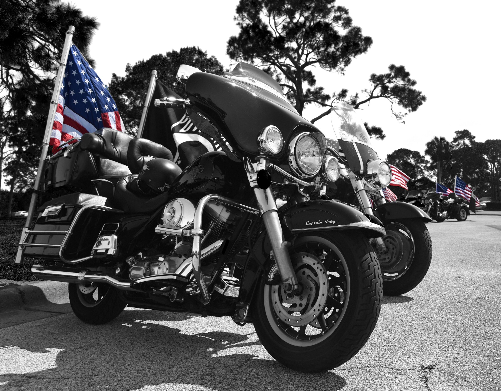 Motorcycles sit in a line