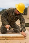 U.S. Marine Corps Lance Cpl. Jacob C. Sadowski, a combat engineer with Bravo Company, 7th Engineer Support Battalion, Task Force Koa Moana (TF KM), hammers a nail during the construction of a South West Asia hut during the TF KM Mission Rehearsal Exercise, at Marine Corps Base Camp Pendleton, Calif., July 18, 2018. The exercise confirmed TF KM is capable of cross cultural interaction, instruction, and relationship building while training alongside partner nations in order to meet Theater Security Cooperation engagement objectives. (U.S. Marine Corps photo by Staff Sgt. Gabriela Garcia)