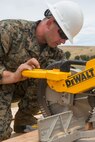 U.S. Marine Corps Lance Cpl. Caleb E. Pratt, a combat engineer with Bravo Company, 7th Engineer Support Battalion, Task Force Koa Moana (TF KM), uses a circular saw during the construction of a South West Asia hut during the TF KM Mission Rehearsal Exercise, at Marine Corps Base Camp Pendleton, Calif., July 18, 2018. The exercise confirmed TF KM is capable of cross cultural interaction, instruction, and relationship building while training alongside partner nations in order to meet Theater Security Cooperation engagement objectives. (U.S. Marine Corps photo by Staff Sgt. Gabriela Garcia)