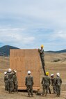 U.S. Marine Corps Cpl. Braiden M. Wadin, top, and other Marine combat engineers with Bravo Company, 7th Engineer Support Battalion, Task Force Koa Moana (TF KM), participate in the construction of a South West Asia hut during the TF KM Mission Rehearsal Exercise, at Marine Corps Base Camp Pendleton, Calif., July 18, 2018. The exercise confirmed TF KM is capable of cross cultural interaction, instruction, and relationship building while training alongside partner nations in order to meet Theater Security Cooperation engagement objectives. (U.S. Marine Corps photo by Staff Sgt. Gabriela Garcia)