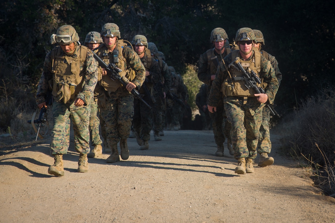 U.S. Marines with Task Force Koa Moana (TF KM) conduct a six mile hike during the TF KM Mission Rehearsal Exercise at Marine Corps Base Camp Pendleton, Calif., July 20, 2018. The exercise increased the task force capability and readiness to execute theatre security cooperation events during TF KM's deployment. (U.S. Marine Corps photo by Staff Sgt. Gabriela Garcia)