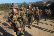 U.S. Marines with Task Force Koa Moana (TF KM) conduct a six mile hike during the TF KM Mission Rehearsal Exercise at Marine Corps Base Camp Pendleton, Calif., July 20, 2018. The exercise increased the task force capability and readiness to execute theatre security cooperation events during TF KM's deployment. (U.S. Marine Corps photo by Staff Sgt. Gabriela Garcia)