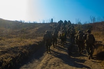 U.S. Marines with Task Force Koa Moana (TF KM) conduct a six mile hike during the TF KM Mission Rehearsal Exercise at Marine Corps Base Camp Pendleton, Calif., July 20, 2018. The exercise increased the task force capability and readiness to execute theatre security cooperation events during TF KM's deployment. (U.S. Marine Corps photo by Staff Sgt. Gabriela Garcia)