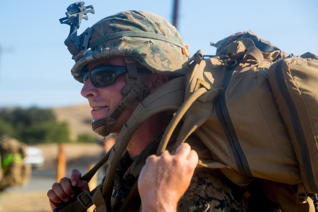 A U.S. Marine with Task Force Koa Moana (TF KM) conducts a six mile hike during the TF KM Mission Rehearsal Exercise at Marine Corps Base Camp Pendleton, Calif., July 20, 2018. The exercise increased the task force capability and readiness to execute theatre security cooperation events during TF KM's deployment. (U.S. Marine Corps photo by Staff Sgt. Gabriela Garcia)
