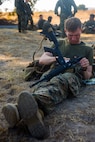 U.S. Marine Corps Staff Sgt. Kyle A. Melvin, a reconnaissance Staff Non-Commissioned Officer, with Task Force Koa Moana (TF KM) cleans a M-4 sevice carbine rifle after a six mile hike during the TF KM Mission Rehearsal Exercise at Marine Corps Base Camp Pendleton, Calif., July 20, 2018. The exercise increased the task force capability and readiness to execute theatre security cooperation events during TF KM's deployment. (U.S. Marine Corps photo by Staff Sgt. Gabriela Garcia)