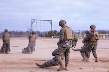 U.S. Marines with Task Force Koa Moana perform buddy drags during a Combat Lifesaver (CLS) course at Marine Corps Base Camp Pendleton, Calif., Sept. 20, 2018. The CLS course taught Marines how to properly apply life-saving interventions in tactical combat situations. (U.S. Marine Corps photo by Cpl. Branden J. Bourque)
