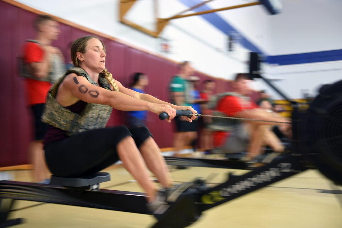 An airman works out on a rower.