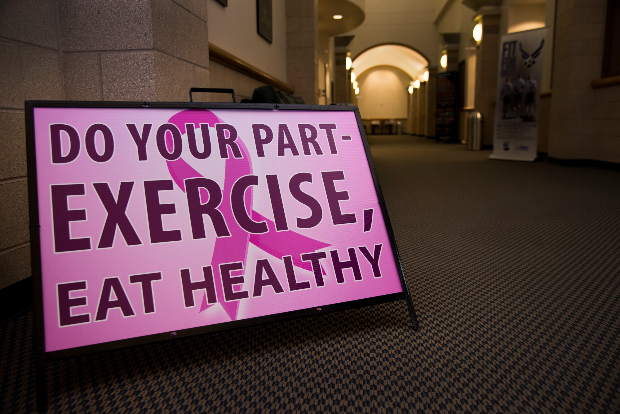 A sign promotes breast cancer awareness at the Losano Fitness Center on Laughlin Air Force Base, Texas, Oct. 5, 2018. About one in eight women in the U.S. will develop invasive breast cancer over the course of her lifetime, according to the National Breast Cancer Foundation. Although breast cancer is more commonly found in women, less than one percent of breast cancer cases develop in men. (U.S. Air Force photo by Airman 1st Class Marco A. Gomez)