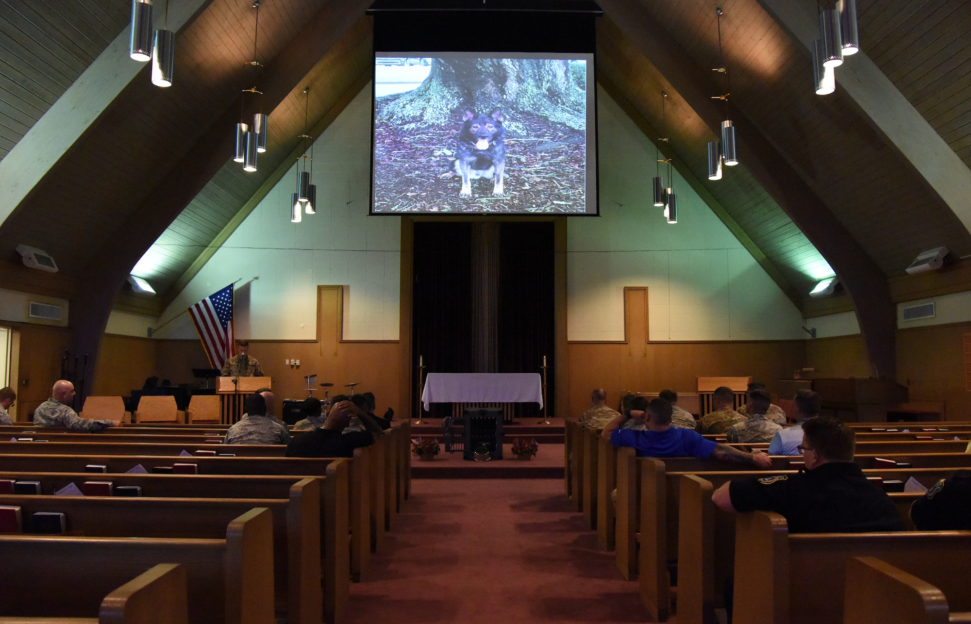 Keesler personnel attends a memorial service for Bady, 81st Security Forces Squadron military working dog, at the Larcher Chapel on Keesler Air Force Base, Mississippi, Oct. 4, 2018. Bady was accepted by the Air Force in 2010. He was certified on patrol and detection before being assigned to the 81st SFS where he completed countless hours of drug detection services over his eight-year career, as well as supporting U.S. customs and multiple local Law enforcement agencies. Bady worked with eight handlers before passing away at the age of 10 on June 14, 2018. (U.S. Air Force photo by Kemberly Groue)