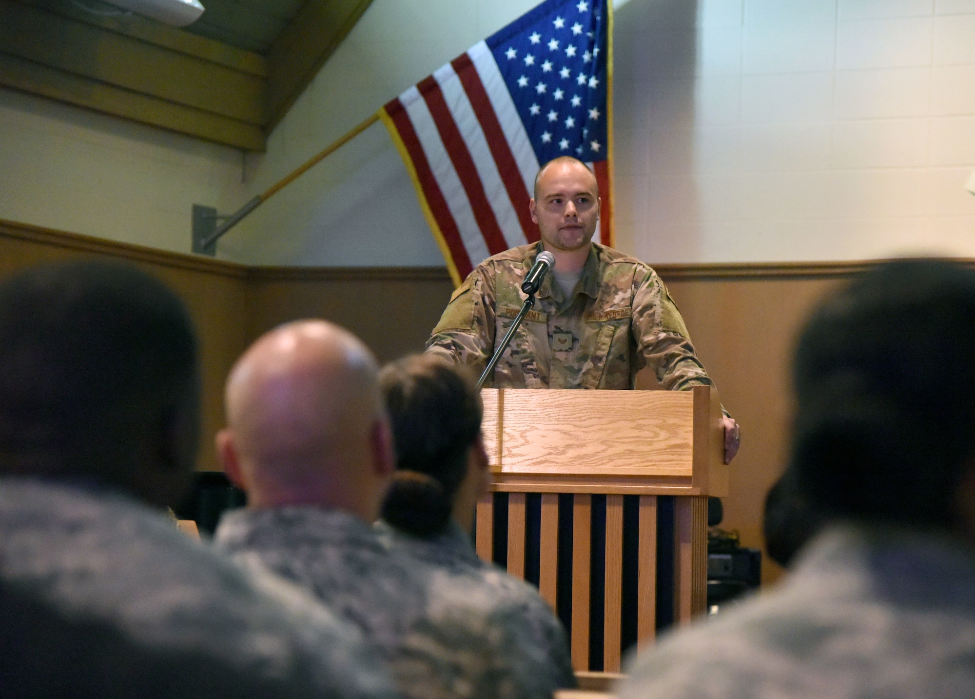 U.S. Air Force Staff Sgt. Timothy Poissant, 81st Security Forces Squadron military working dog handler, delivers remarks during a memorial service for Bady, 81st SFS military working dog, at the Larcher Chapel on Keesler Air Force Base, Mississippi, Oct. 4, 2018. Bady was accepted by the Air Force in 2010. He was certified on patrol and detection before being assigned to the 81st SFS where he completed countless hours of drug detection services over his eight-year career, as well as supporting U.S. customs and multiple local Law enforcement agencies. Bady worked with eight handlers before passing away at the age of 10 on June 14, 2018. (U.S. Air Force photo by Kemberly Groue)