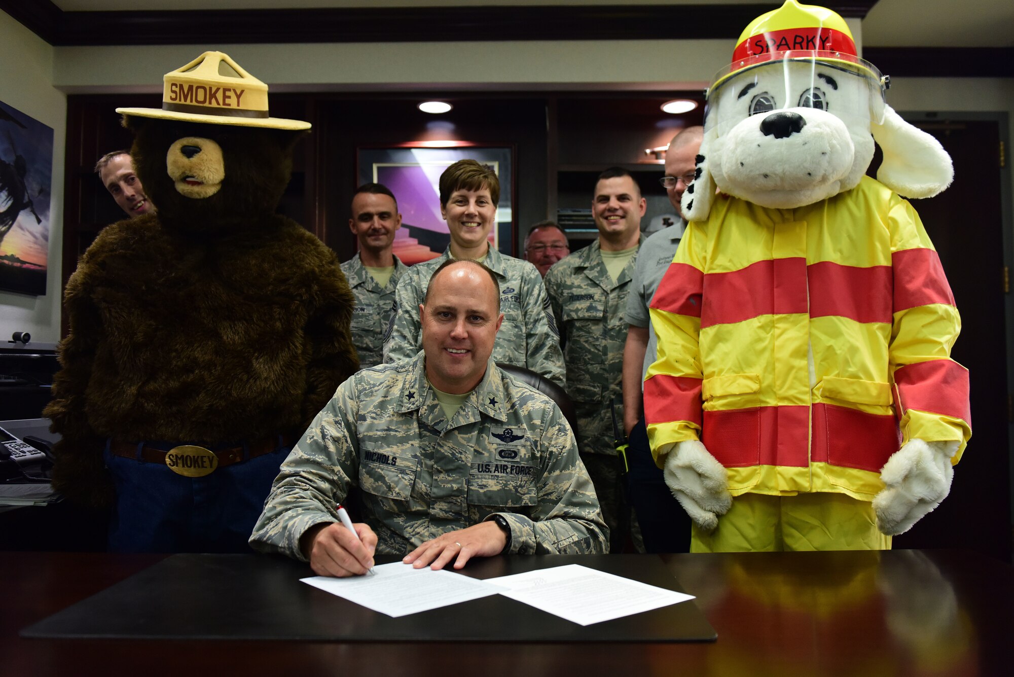 Brig. Gen. John Nichols, 509th Bomb Wing commander, signs the Fire Prevention Week Proclamation at Whiteman Air Force Base, Missouri, Sept. 5, 2018. National Fire Prevention Week is Oct. 7-13, 2018, and educates people about three basic, but essential, steps to reduce the likelihood of an accidental fire as well as how to escape safely if there is one. (U.S. Air Force photos by Staff Sgt. Joel Pfiester)