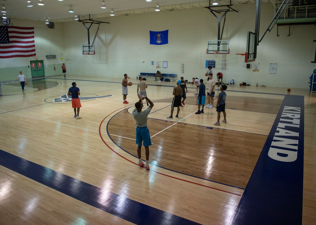 Members of Team Kirtland play a game of pick-up basketball in the newly renovated West Fitness Center at Kirtland Air Force Base, N.M., Oct. 4, 2018. The renovations included a new ventilation system and a resurfaced floor. (U.S. Air Force photo by Staff Sgt. J.D. Strong II)
