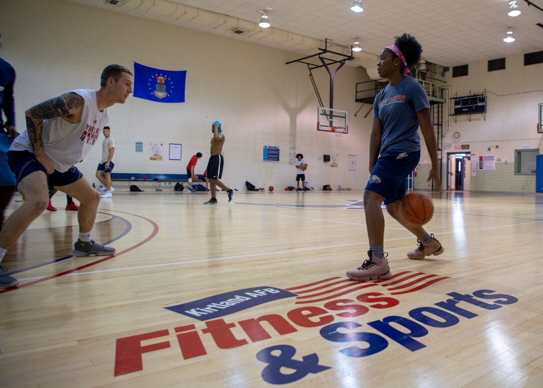 Members of Team Kirtland play a game of pick-up basketball in the newly renovated West Fitness Center at Kirtland Air Force Base, N.M., Oct. 4, 2018. The renovations included a new ventilation system and a resurfaced floor. (U.S. Air Force photo by Staff Sgt. J.D. Strong II)