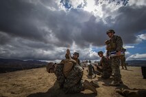 U.S. Marines with Weapons Platoon, A Company, Infantry Training Battalion, School of Infantry-West, prepare to fire a 60mm mortar round during the Basic Mortarman Course at Range Mortar Position 6, Marine Corps Base Camp Pendleton, California, Oct. 4, 2018.