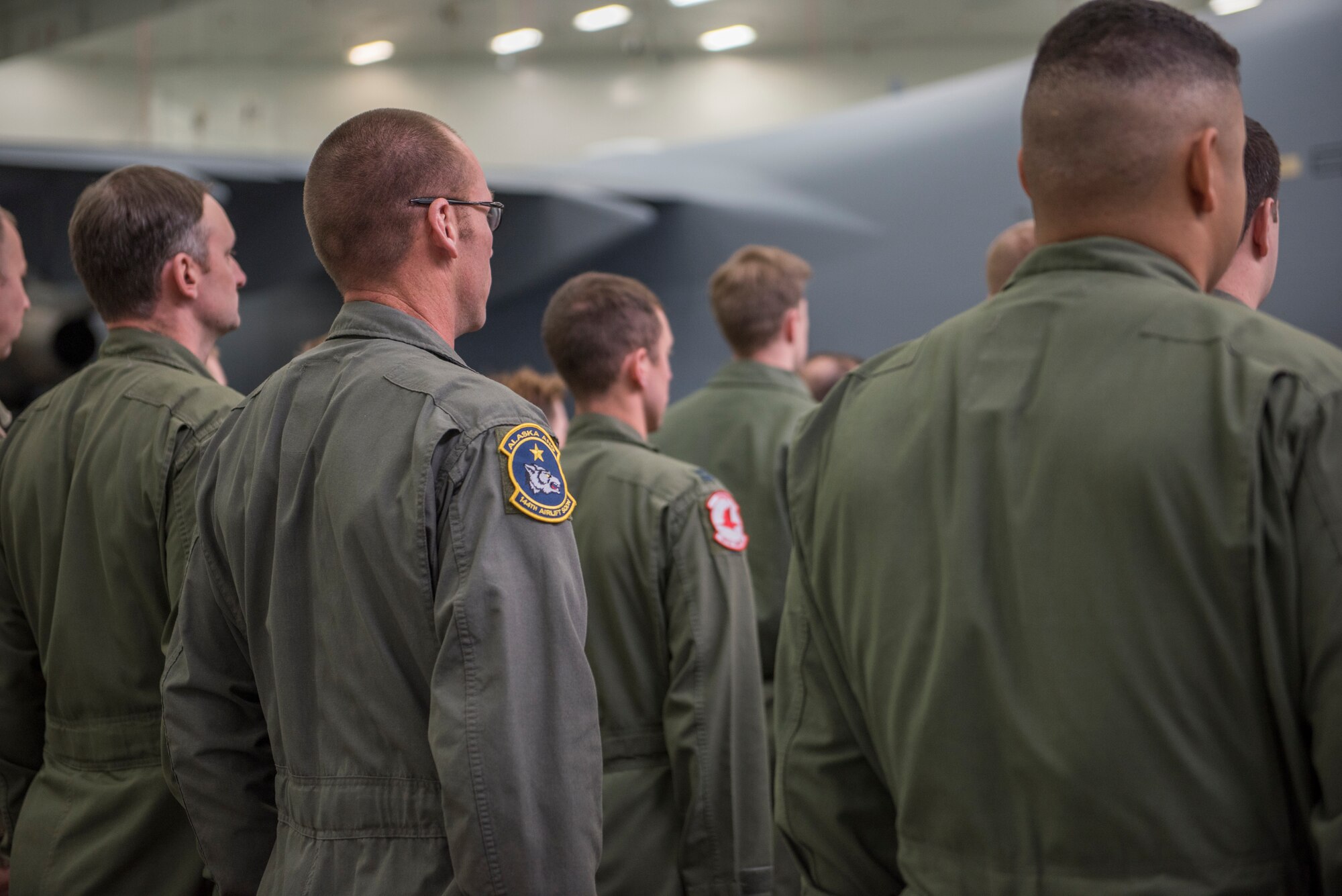Members of the Alaska Air National Guard’s 176th Wing and the Regular Air Force’s 3rd Wing witnessed the unveiling of a new tail flash on the C-17 Globemaster IIIs assigned to the 176th Wing’s 144th Airlift Squadron at Joint Base Elmendorf-Richardson, Alaska, Oct. 1, 2018. The new tail flash depicts a wolf head, (the 144th AS’s emblem), on one side, and a firebird (the 517th AS’s emblem), of equal size on the other. (U.S. Air National Guard photo by Tech. Sgt. N. Alicia Halla)