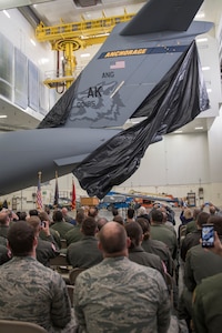 Members of the Alaska Air National Guard’s 176th Wing and the Regular Air Force’s 3rd Wing witnessed the unveiling of a new tail flash on the C-17 Globemaster IIIs assigned to the 176th Wing’s 144th Airlift Squadron on Joint Base Elmendorf-Richardson, Alaska, Oct. 1, 2018. The new tail flash depicts a wolf head, (the 144th AS’s emblem), on one side, and a firebird (the 517th AS’s emblem), of equal size on the other. (U.S. Air National Guard photo by Tech. Sgt. N. Alicia Halla)