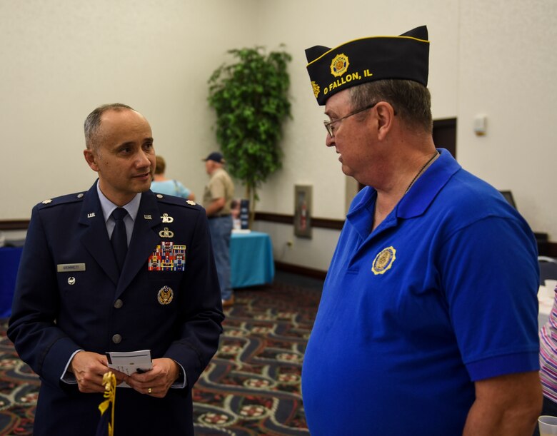 Col. Robert Grimmet, 375th Mission Support Group deputy commander, speaks with retired Air Force Col. Jim Harper during Scott Air Force Base’s 33rd annual Retiree Appreciation Day, Oct. 6, 2018. Retirees were given the opportunity obtain information from several booths including the American Legion, Red Cross, Veterans of Foreign Wars, and Airman and Family Readiness Center as well as have the ability to receive immunizations and update identification cards. (U.S. Air Force Photo by Airman 1st Class Chad Gorecki)