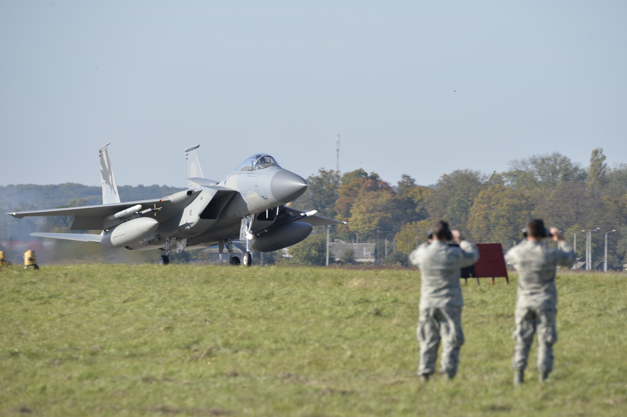 A U.S. Air Force F-15C Eagle fighter jet lands for the first time ever, Oct. 6, on Ukrainian soil, as U.S. Airmen watch, to participate in CLEAR SKY 2018.