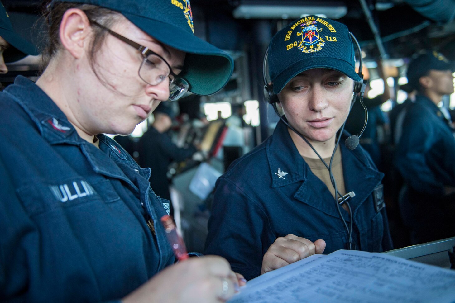 181006-N-NU281-0471 PORT MORESBY, Papua New Guinea (Oct. 6, 2018) Personnel Specialist 3rd Class Maile Mullins, left, and Operations Specialist 3rd Class Laura Sanford log the course of the Arleigh-Burke class guided-missile destroyer USS Michael Murphy (DDG 112) as it arrives in Papua New Guinea. As the first U.S. Navy ship to visit Port Moresby since USS Comstock (LSD 45) in 2017, Michael Murphy arrives as the nation prepares to host the Asia-Pacific Economic Cooperation (APEC) Leaders’ Summit for the first time in Nov. 2018. Michael Murphy is forward-deployed to the U.S. 7th Fleet area of operations.