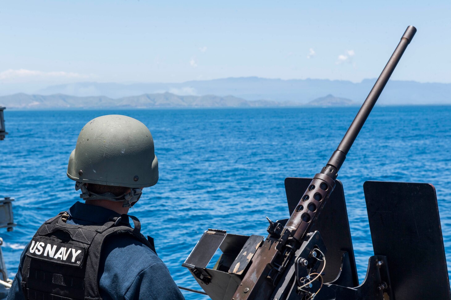 PORT MORESBY, Papua New Guinea (Oct. 6, 2018) Fire Controlman 2nd Class Christian Koch stands watch aboard the Arleigh-Burke class guided-missile destroyer USS Michael Murphy (DDG 112) as it arrives in Papua New Guinea. As the first U.S. Navy ship to visit Port Moresby since USS Comstock (LSD 45) in 2017, Michael Murphy arrives as the nation prepares to host the Asia-Pacific Economic Cooperation (APEC) Leaders’ Summit for the first time in Nov. 2018. Michael Murphy is forward-deployed to the U.S. 7th Fleet area of operations in support of security and stability in the Indo-Pacific region.